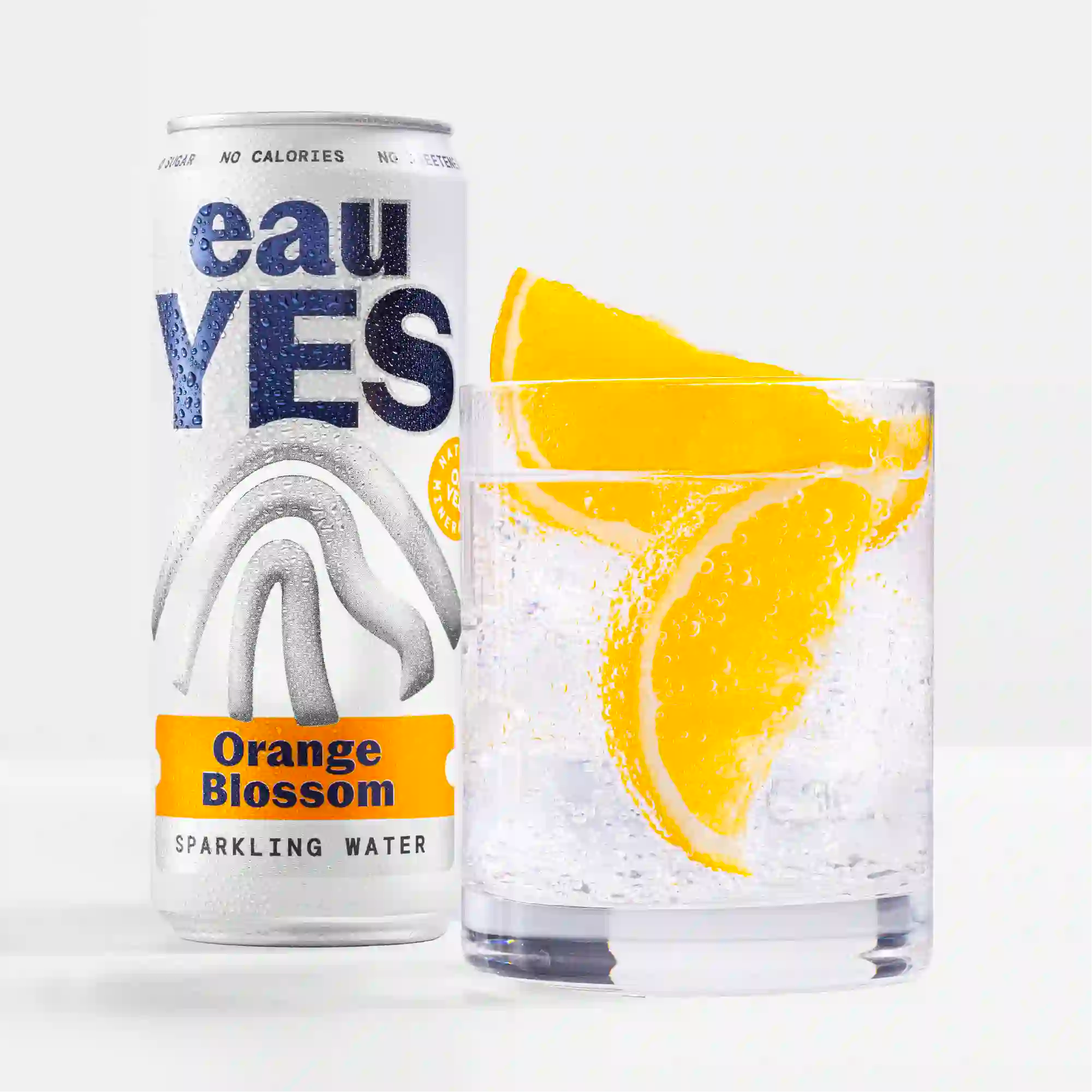 eauYES orange blossom sparkling water can and glass